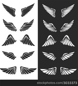 Set of wings on white background. Design elements for logo, label, emblem, sign. Vector image. Set of wings on white background. Design elements for logo, label, emblem, sign.
