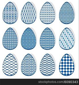 Set with Easter eggs with blue ornamental patterns, isolated on white background.