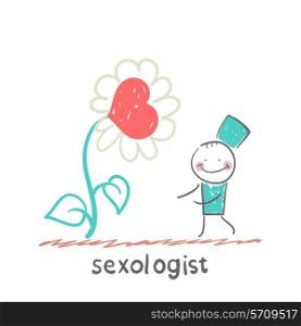 Sexologist stands near a large flower with a heart