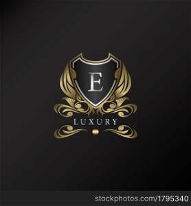 Shield logo in gold color with letter E Logo. Elegant logo vector template made of wide silver alphabet font on shield frame ornate style.