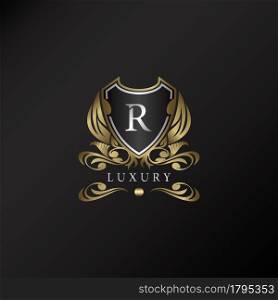 Shield logo in gold color with letter R Logo. Elegant logo vector template made of wide silver alphabet font on shield frame ornate style.