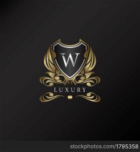 Shield logo in gold color with letter W Logo. Elegant logo vector template made of wide silver alphabet font on shield frame ornate style.