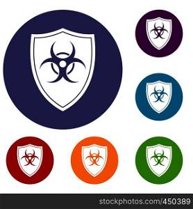 Shield with a biohazard sign icons set in flat circle reb, blue and green color for web. Shield with a biohazard sign icons set