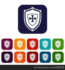 Shield with cross icons set vector illustration in flat style in colors red, blue, green, and other. Shield with cross icons set