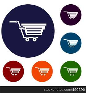 Shopping basket on wheels icons set in flat circle red, blue and green color for web. Shopping basket on wheels icons set