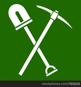 Shovel and pickaxe icon white isolated on green background. Vector illustration. Shovel and pickaxe icon green