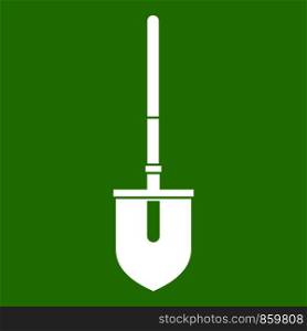 Shovel icon white isolated on green background. Vector illustration. Shovel icon green