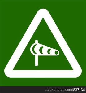 Sign warning about cross wind from the left icon white isolated on green background. Vector illustration. Sign warning about cross wind from the left icon green