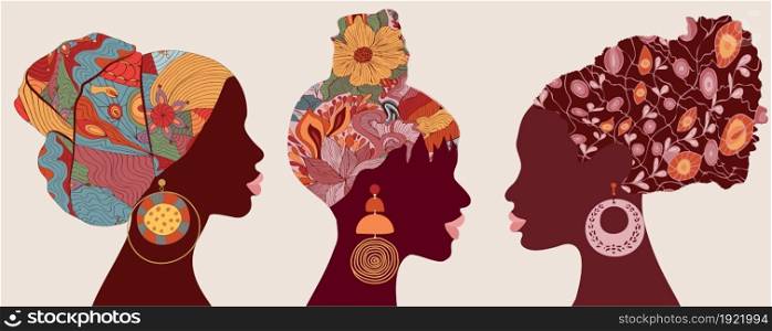 Silhouette faces in profile African or African American women with ethnic or tribal hair decorations and with large earrings. African culture. Racial equality concept