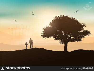 Silhouette of a father and son walking in the countryside