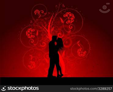 Silhouette of a kissing couple on a decorative background