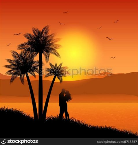 Silhouette of a kissing couple on a tropical landscape