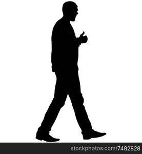 Silhouette of a walking man on a white background.. Silhouette of a walking man on a white background