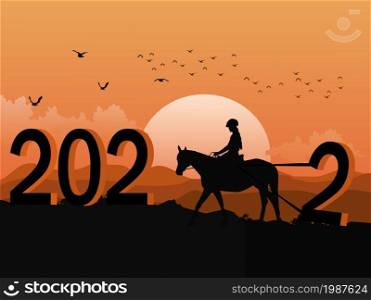 Silhouette of a woman riding a horse using a rope to drag the number two up the mountain. The number 2022 on it has mountains and sunset in the background.