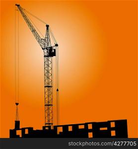Silhouette of crane on a sunset on a building