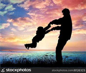 Silhouette Of Father And Son Playing Together At The Beach