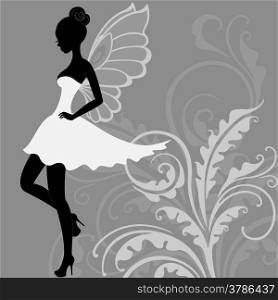 Silhouette of young beautiful fairy in white dress