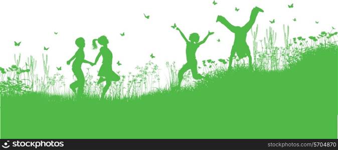 Silhouettes of children playing in grass and flowers