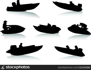 Silhouettes of people on motor boats