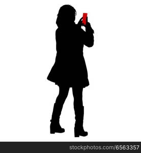 Silhouettes woman taking selfie with smartphone on white background.. Silhouettes woman taking selfie with smartphone on white background