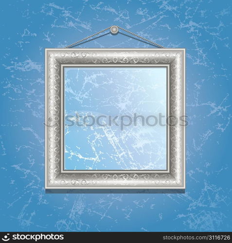 Silver frame on the wall with blue wallpaper