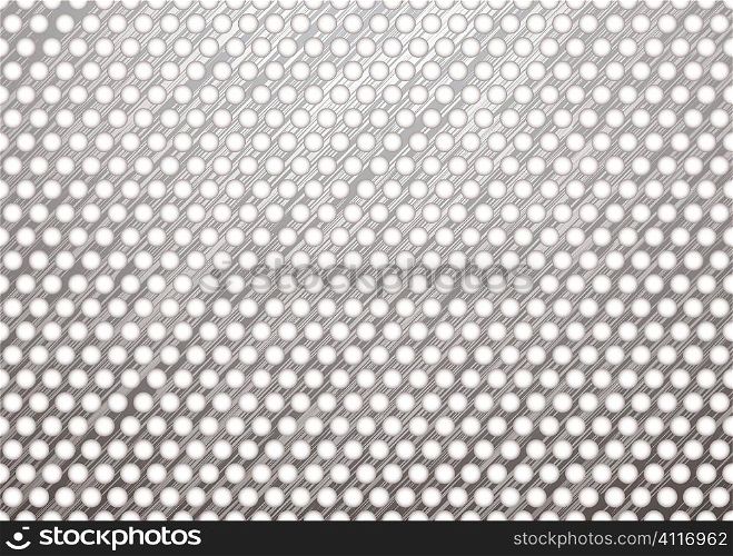 silver metal background with brushed surface and white holes
