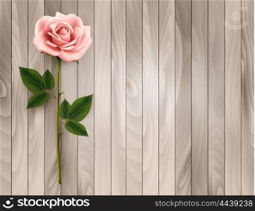 Single pink rose on an old wooden background. Vector.