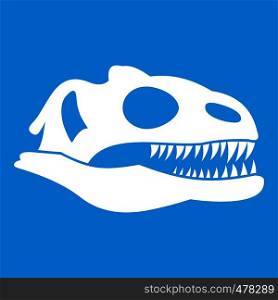 Skull of dinosaur icon white isolated on blue background vector illustration. Skull of dinosaur icon white