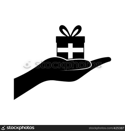 Small gift box in a hand black simple icon. Small gift box in a hand icon