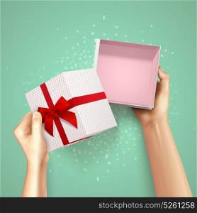 Small Gift Package Composition. Hands holding gift box top view realistic background with square carton and red fillet with bow vector illustration