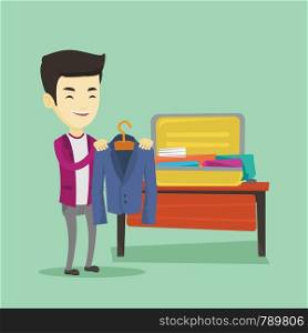 Smiling asian business man putting a suit into a suitcase. Young business man packing his clothes in an opened suitcase. Man preparing for vacation. Vector flat design illustration. Square layout.. Young man packing his suitcase vector illustration