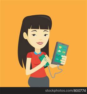 Smiling asian woman recharging her smartphone with mobile phone portable battery. Young woman holding a mobile phone and battery power bank. Vector flat design illustration. Square layout.. Woman reharging smartphone from portable battery.