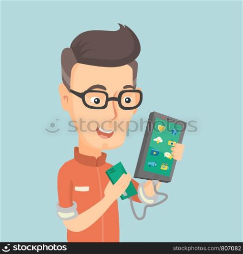 Smiling caucasian man recharging his smartphone with a mobile phone portable battery. Happy man holding a mobile phone and a battery power bank. Vector flat design illustration. Square layout.. Man reharging smartphone from portable battery.