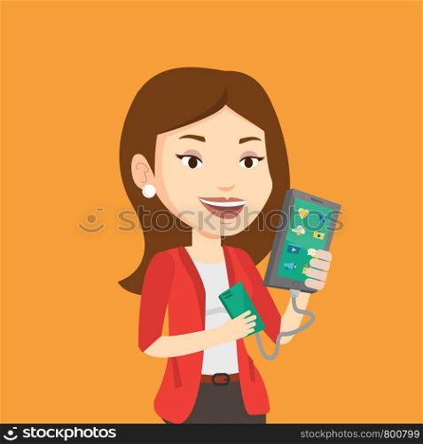 Smiling caucasian woman recharging her smartphone with mobile phone portable battery. Young woman holding a mobile phone and battery power bank. Vector flat design illustration. Square layout.. Woman reharging smartphone from portable battery.