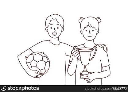 Smiling children in uniform stand hold football ball and golden prize celebrate win in game. Happy kids players with gold trophy after match. Vector illustration. . Smiling children with ball and golden prize 