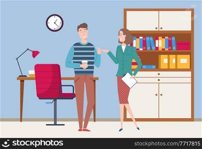 Smiling colleagues have a friendly conversation. Business meeting or working process. Woman standing in office workspace holding a document talking to man. Project management and teamwork concept. Smiling colleagues have a friendly conversation. Business meeting or working process in office