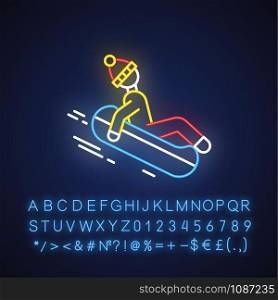 Snow tubing neon light icon. Winter extreme sport, risky activity and adventure. Person sliding, riding inflatable ring. Glowing sign with alphabet, numbers and symbols. Vector isolated illustration
