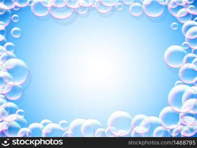 Soap bubbles blue background with rainbow colored airy foam