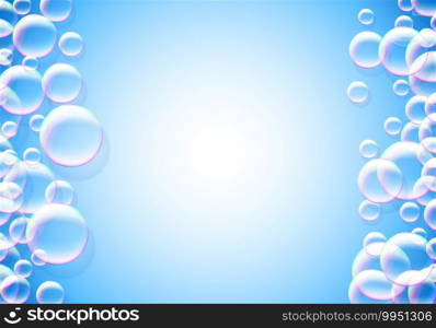 Soap bubbles blue background with rainbow colored airy foam