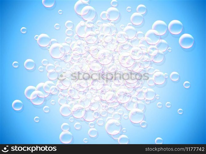 Soap bubbles blue background with rainbow colored airy foam explosion