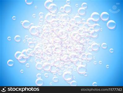 Soap bubbles blue background with rainbow colored airy foam explosion