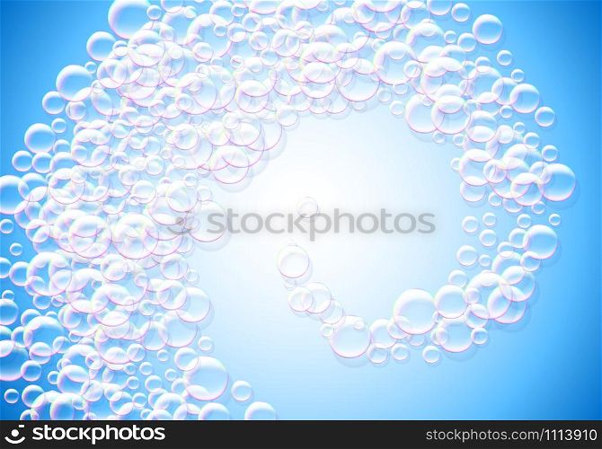 Soap bubbles blue background with rainbow colored airy foam spiral or swirl