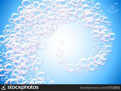 Soap bubbles blue background with rainbow colored airy foam spiral or swirl
