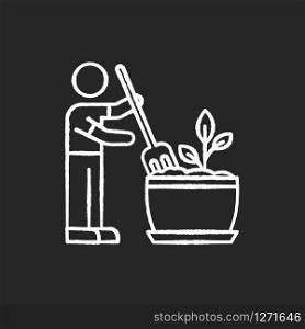 Soil fluffing chalk white icon on black background. Plowing, ploughing earth. Houseplant care. Aeration. Plant growing, planting process. Indoor gardening. Isolated vector chalkboard illustration