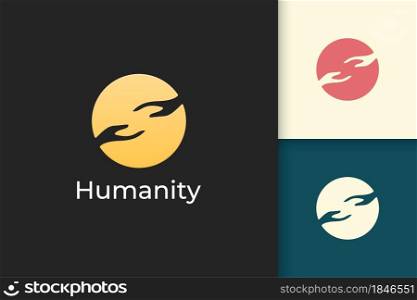 Solidarity or humanity logo in simple circle with two hand reaching