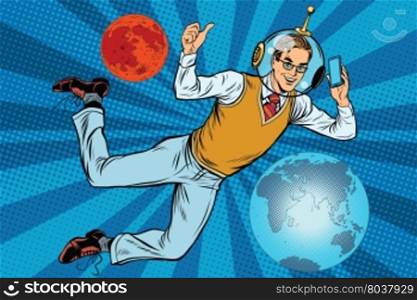 Space businessman with smartphone over the planet Earth and Mars pop art retro vector. New technology. science fiction. Male astronaut. Space business. Space businessman with smartphone over the planet Earth and Mars