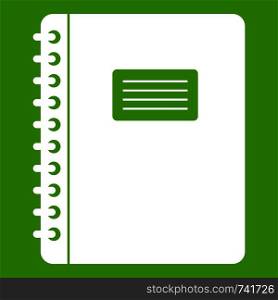 Spiral notepad icon white isolated on green background. Vector illustration. Spiral notepad icon green