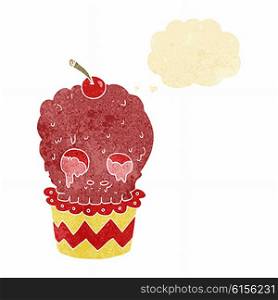 spooky skull cupcake cartoon with thought bubble