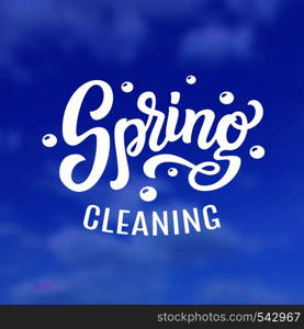 Spring cleaning. Hand drawn lettering on sky blurred background. Vector typography