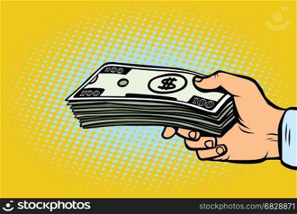 Stack of dollars in hand, a bribe. Pop art retro vector illustration. Stack of dollars in hand, a bribe